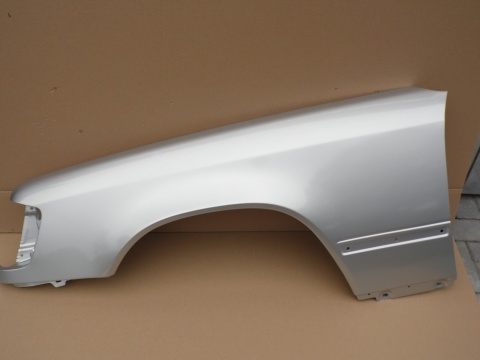 Mercedes E-Klasa W124 84-96r. błotnik lewy srebrny 744