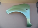 Opel Agila B 08-15r błotnik lewy zielony ZJD